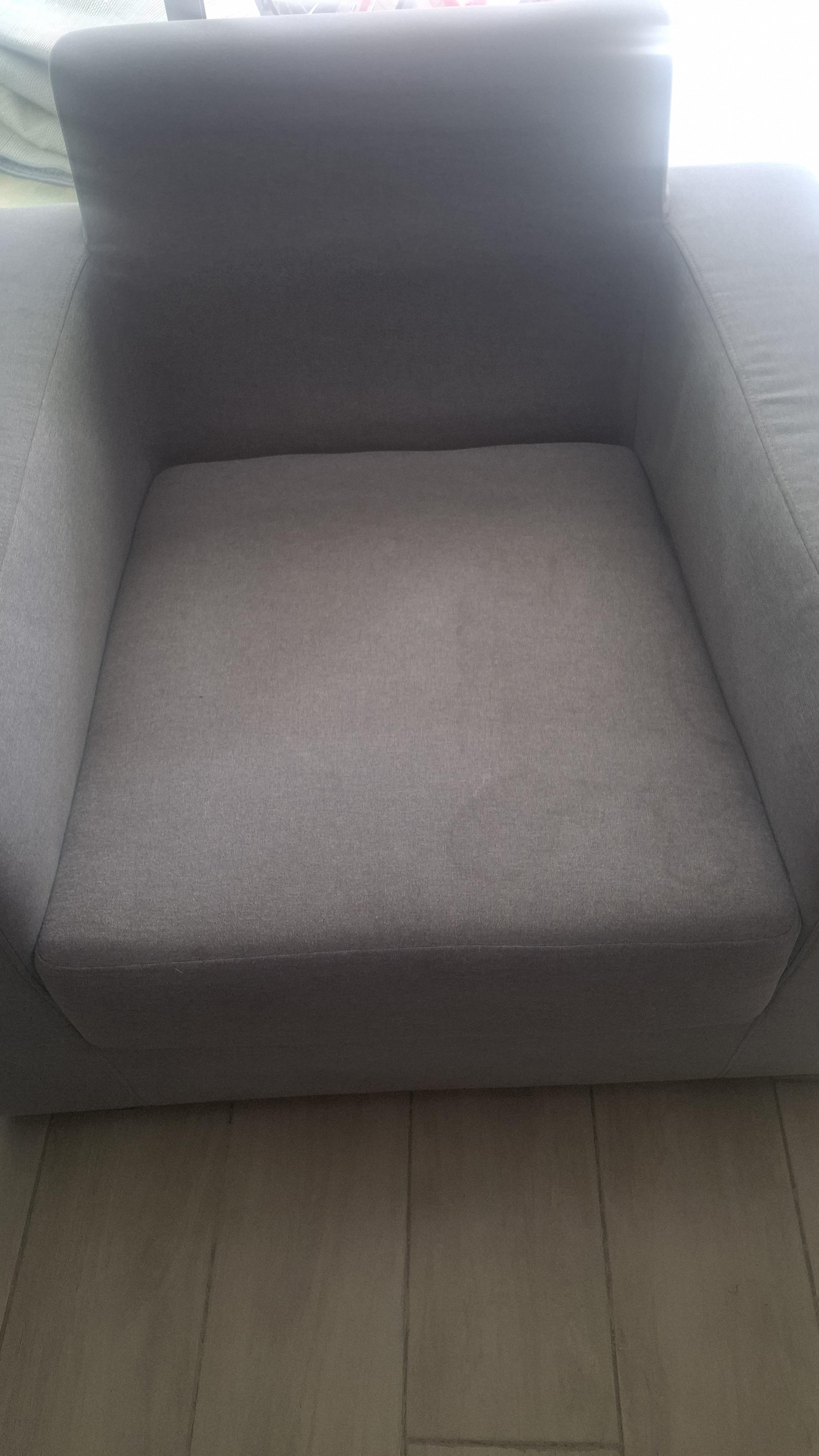 Upholstered armchair before cleaning