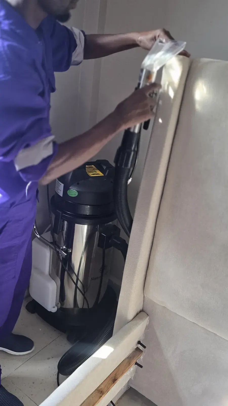 Extraction cleaning on an upholstered bed frame