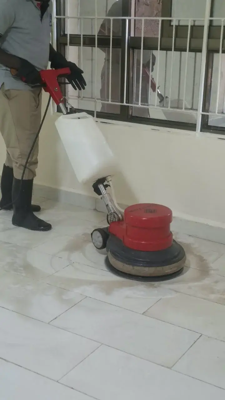 Machine cleaning a tiled floor